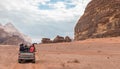 Tourists ride in open jeeps in the Wadi Rum desert Visitor near Aqaba city in Jordan