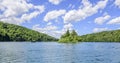 Tourists ride on pleasure boats on Lake Kazyak, in the national park Plitvice Lakes.