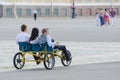Tourists ride tricycle in St. Petersburg
