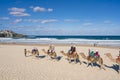 Tourists riding camels at Bondi Beach, Sydney Royalty Free Stock Photo