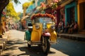 Tourists riding on a colorful tuk-tuk through narrow street - stock photography concepts