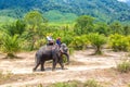 Tourists riding elephant in Thailand