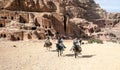 Tourists riding a horse