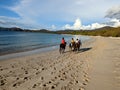 Tourists riding horses in playa Conchal Costa Rica