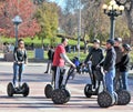 Tourists riding Segways. Royalty Free Stock Photo