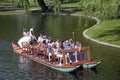 Tourists riding the Swan Boats