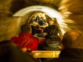 Tourists riding the train through the Postojna cave Royalty Free Stock Photo