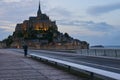 Tourists on the road to famous saint Michel island in France