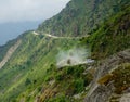 Tourists on road trip to Tibet drive a jeep down a dirt road in the Himalayas. Royalty Free Stock Photo