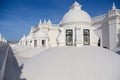 Tourists on the roof of the white cathedral of Leon in Nicaragua. Royalty Free Stock Photo