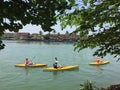 Tourists rowing kayak in Hoian, Vietnam