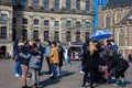 Tourists at the Royal Palace of Amsterdam located at Dam Square