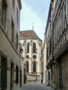 Tourists in Rue du Rabot with a view of the exterior, south chevet elevation of the Ãâ°glise Notre-Dame