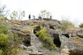 Tourists on ruins medieval city Chufut-Kale Crimea