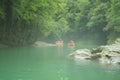 Tourists sail on a rubber boat along the canyon. Georgia