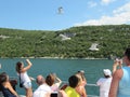 Tourists sailing on the ferry to feed seagulls and take pictures. Croatia, Istra - July 20, 2010.