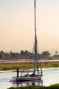 Tourists sale on felucca on Nile river on the sunset in Egypt Royalty Free Stock Photo