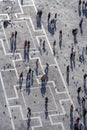 Tourists on San Marco square feed large flock of pigeons. San Marco square is the largest and most famous square in Venice