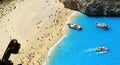 Tourists on the sand beach of Navagio Zakynthos Greece