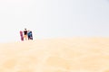 Tourists Sand Skiing In The Desert Royalty Free Stock Photo