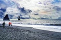 Tourists Sea Stacks Reynisfjara Black Sand Beach Iceland