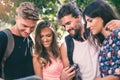 Tourists searching for direction using paper map Royalty Free Stock Photo