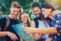 Tourists searching for direction using paper map Royalty Free Stock Photo