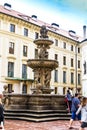 Tourists at the second courtyard of Prague Castle Prazsky hrad with Kohl Fountain Royalty Free Stock Photo