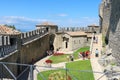 Tourists see the sights in courtyard of old fortress