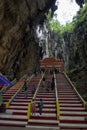 Tourists seen exploring and praying in the Hindu Temple, Batu Caves, Malaysia. Royalty Free Stock Photo