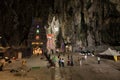 Tourists seen exploring and praying in the Hindu Temple, Batu Caves, Malaysia. Royalty Free Stock Photo