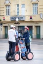 Tourists on Segways and tour city guide