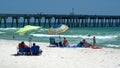 Tourists with shade umbrellas on the beach