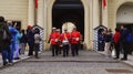 Tourists shoot the guard of honor ceremony at Prague Castle