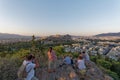 Tourists shooting acropolis and Athens cityscape