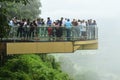 The Tourists are shooting photograph on SkyWalk. SkyWalk is a clear glass walkway to view the Mekong River