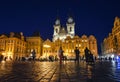 Tourists sightsee late at night in Old Town Square under the lighted towers of Our Lady Before Tyn Church in the Prague Czechia Royalty Free Stock Photo