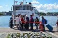 Tourists by a sightseeing boat in Stockholm Royalty Free Stock Photo