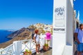 Tourists sightseeing in the incredible Fira town Santorini island Greece Royalty Free Stock Photo