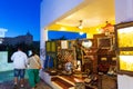 Tourists sightseeing on night streets of Oia town Santorini Greece