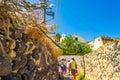 Tourists sightseeing at old abondened streets Santorini Greece