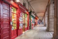 Tourists sightseeing and walking through the old and vintage streets of Madrid at castizo arcades at town square