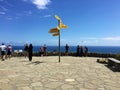 Tourists and signpost at Cape Reinga, Northland, New Zealand