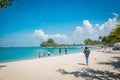 Tourists in Siloso beach, Sentosa island, Singapore. Royalty Free Stock Photo