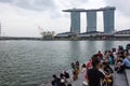 Tourists at the Singapore Merlion Park overlooking Marina Bay Sa