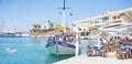 Tourists in Sissi harbor, Crete. Royalty Free Stock Photo