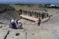Tourists sit in the spectacular Roman Theatre at Hierapolis near Pamukkale in Turkey.