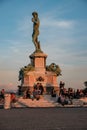 Tourists sit on the steps under the monument of David in the Piazzale Michelangelo 10 October 2017, Florence, Italy