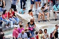 Tourists sitting around the Fountain of the Boat below the Spanish Steps Royalty Free Stock Photo