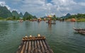 Tourists on bamboo rafts on Yulong River in Yangshuo